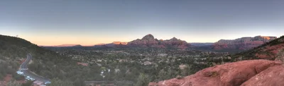 desert valley town beneath red rock formations